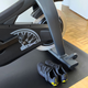 View of shoes, mat, and lower half of the bike.
